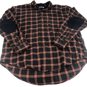 May include: A long-sleeved plaid shirt in black, red, and yellow. The shirt features black elbow patches and a button-down front. The collar has a black lining. The shirt is made of a soft, comfortable material.
