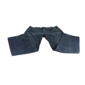 May include: A pair of blue denim jeans with a classic five-pocket design. The jeans have a straight leg cut and are made of a medium-wash denim fabric. The jeans are laid flat on a white background.