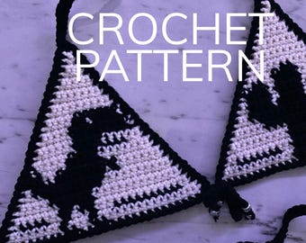 May include: A crochet bikini top pattern featuring a black and white dinosaur design. The pattern is written in English and includes instructions for crocheting the top.