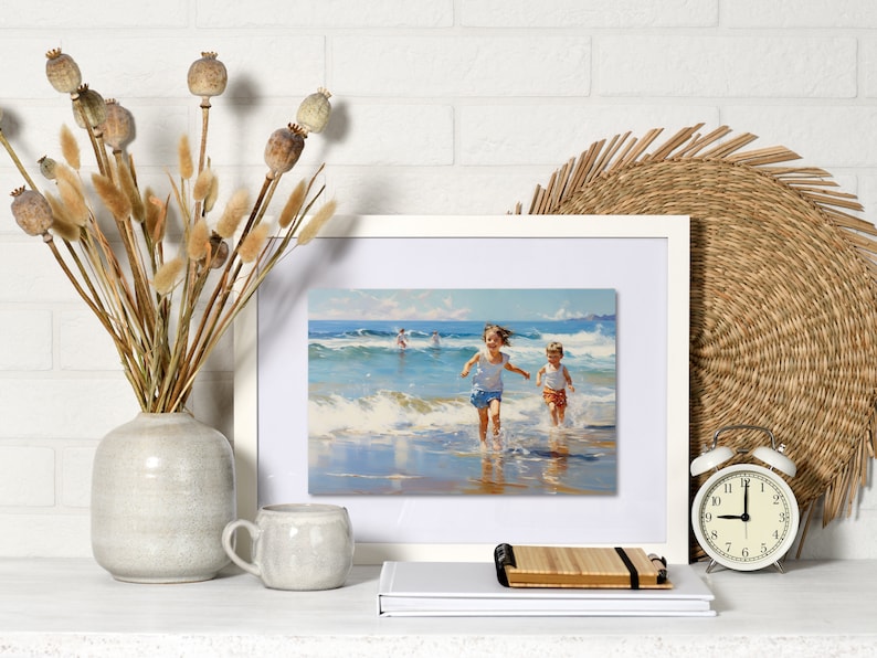 May include: A framed painting depicting two children running on a beach with waves crashing behind them. The painting is in a white frame and is hanging on a white brick wall.