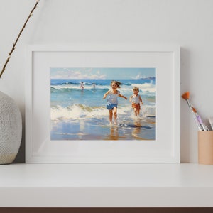 May include: A framed painting depicting two children running on a beach with waves crashing around them. The painting is in a white frame and is displayed on a white shelf with a vase of white branches and a brown pencil holder containing paintbrushes.