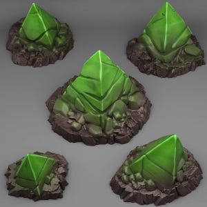 May include: Five green crystal formations on a rocky base. The crystals are pyramid shaped and have a smooth, polished surface. The base is made of rough, dark gray rock.