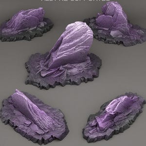 May include: Five purple rock formations with textured surfaces and jagged edges. Each rock sits on a dark gray, irregular base. The rocks vary in shape and size, with a consistent color palette.