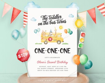 May include: A yellow school bus with a number one on the side, carrying a zebra, giraffe, and lion. The bus is surrounded by colourful balloons and a stop sign. The text reads "The toddler on the bus turns ONE-ONE-ONE. Let's celebrate Oliver's Second Birthday. Sunday, May 18th at 2:00 PM. 912 Happy Street, Awesome City. RSVP to Bus Driver 123-456-7890. The Party Central."