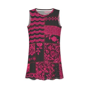 May include: A sleeveless tank top featuring a black base with a vibrant hot pink patchwork print. The design incorporates various patterns including scalloped lace borders, floral motifs, and geometric shapes arranged in a grid-like layout.