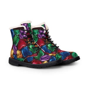 May include: Ankle boots featuring a vibrant, multi-colored abstract pattern of thick, glossy paint strokes in shades of red, blue, green, purple, and gold. The boots have black laces, black soles, and a white faux-fur lining at the top collar.
