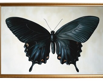 May include: A framed painting of a large black butterfly with detailed wing patterns. The butterfly is centered on a cream-colored background, and the frame is gold. The artwork is a nature-themed piece.