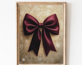 May include: A framed print of a large, burgundy bow on a gold background with white snowflakes. The print is titled "meyaya."