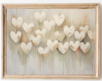 Puede incluir: Una pintura enmarcada que representa una pared de madera gris claro con un grupo de corazones blancos y crema pintados sobre ella. Los corazones están dispuestos de forma aleatoria y parecen flotar en el aire. La pintura tiene un aspecto rústico y vintage.