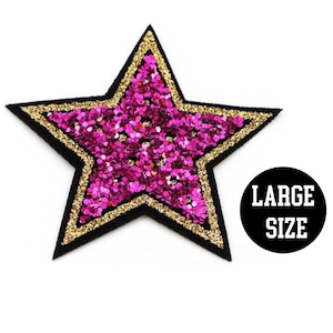 May include: A large pink and gold glitter star iron-on patch. The patch has a black outline and the text "LARGE SIZE" is printed on a black circle.