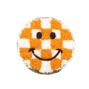 May include: Orange and white checkered smiley face patch with a black embroidered smile.