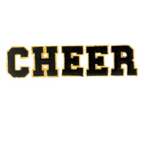 May include: Black felt letters spelling out the word "CHEER" with gold outlining.