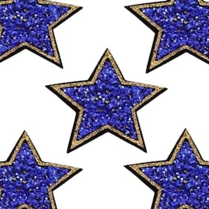May include: Five blue glitter stars with gold outlines. The stars are on a white background.