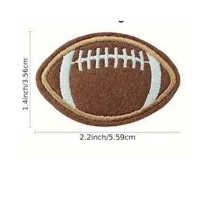 May include: Brown felt football patch with white stitching and a white outline. The patch is 2.2 inches wide and 1.4 inches tall.