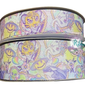 May include: Two spools of white satin ribbon with a multi-colored print of tigers, unicorns, smiley faces, and flowers. The ribbon is 1.5 inches wide.