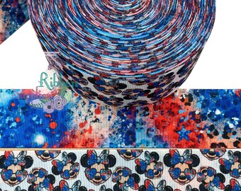 May include: Red, white, and blue patterned ribbon with a Mickey Mouse design. The ribbon is rolled up and shows the pattern on both sides.