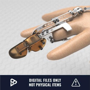 May include: A 3D printed robotic finger, made of silver and brown metal, is attached to a hand. The finger is articulated and has a series of gears and joints.