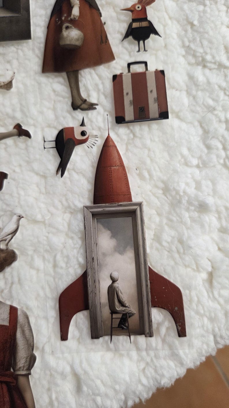 May include: A collage of paper cutouts featuring a red rocket with a framed image of a person, a bird, a suitcase, and a figure in a dress. The background is a fluffy white texture.