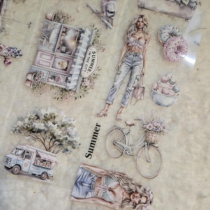 May include: A collection of decorative stickers featuring watercolor illustrations. The stickers depict summer scenes, including a bicycle with a flower basket, a food truck, and fashion illustrations of women. The text "Summer" is visible.