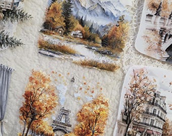 Op de afbeelding: Een verzameling vierkante stickers met aquarelillustraties van herfstlandschappen, waaronder bergketens, hutten, de Eiffeltoren omringd door gouden bomen en Europese stadsarchitectuur in warme oranje en bruine tinten.