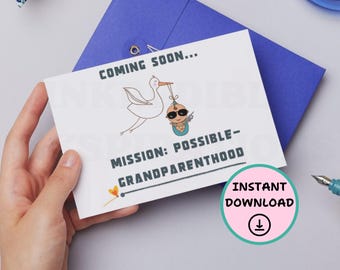 May include: A white rectangular card featuring a cartoon stork carrying a baby wearing sunglasses and holding a small toy gun. The text reads COMING SOON... MISSION: POSSIBLE-GRANDPARENTHOOD. A small orange heart icon is located near the bottom left corner.