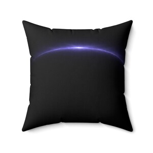 May include: Square black throw pillow featuring a glowing, curved, purple light design across the top. The pillow has a solid black background and a soft, textured appearance. The pillow is designed for home decor.