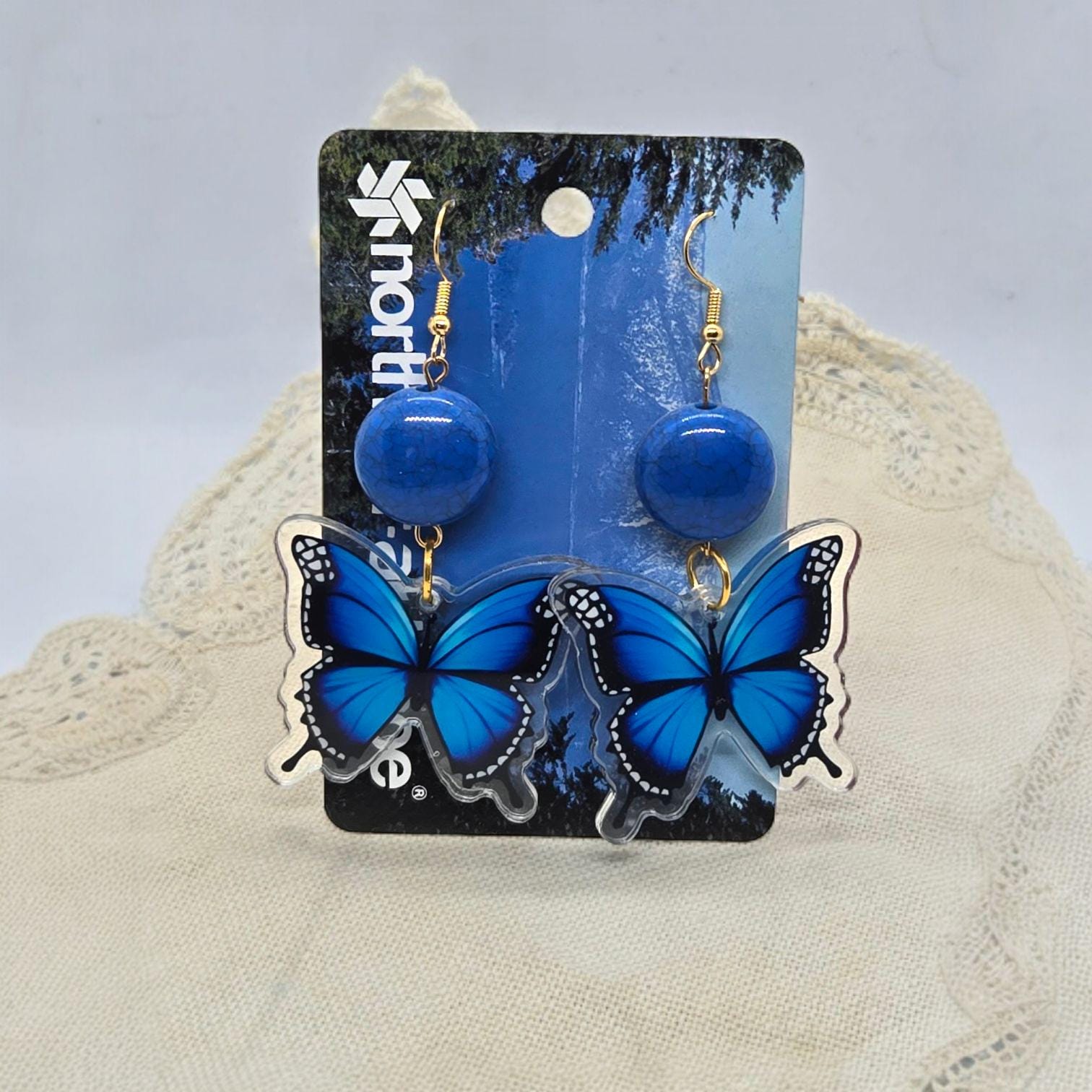 boucle d'oreille papillon teinté rose