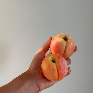 Realistic peach candle