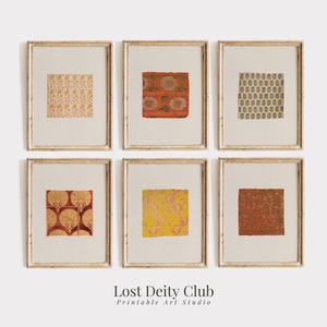 May include: Six framed prints of colorful patterned fabric swatches. The frames are light wood with a white mat. The prints are arranged in two rows of three. The text "Lost Deity Club Printable Art Studio" is below the prints.