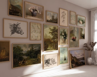 May include: A gallery wall with a variety of framed artwork, including landscapes, still lifes, and abstract designs. The frames are all in a similar style, with a light wood finish. The wall is painted a light beige color.