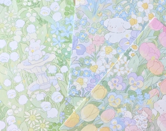 May include: Four different patterned sheets of paper with a floral design. The patterns include a light green background with white flowers, a light blue background with purple and yellow flowers, a light pink background with pink and yellow flowers, and a light blue background with pink and yellow flowers.
