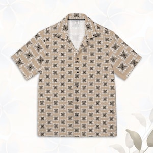 May include: A beige short-sleeved button-down shirt with a white and black floral pattern.