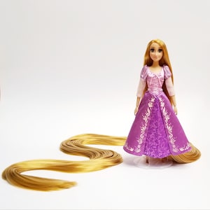 Disney store Rapunzel doll with 55 inch long saran hair ( reroot )