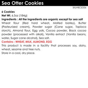 May include: A product label for Sea Otter Cookies, SKU#BCSO06, containing 6 cookies with a net weight of 6.5oz. The label lists organic ingredients including wheat flour, butter, powder sugar, almond flour, egg yolk, cocoa, and vanilla extract.