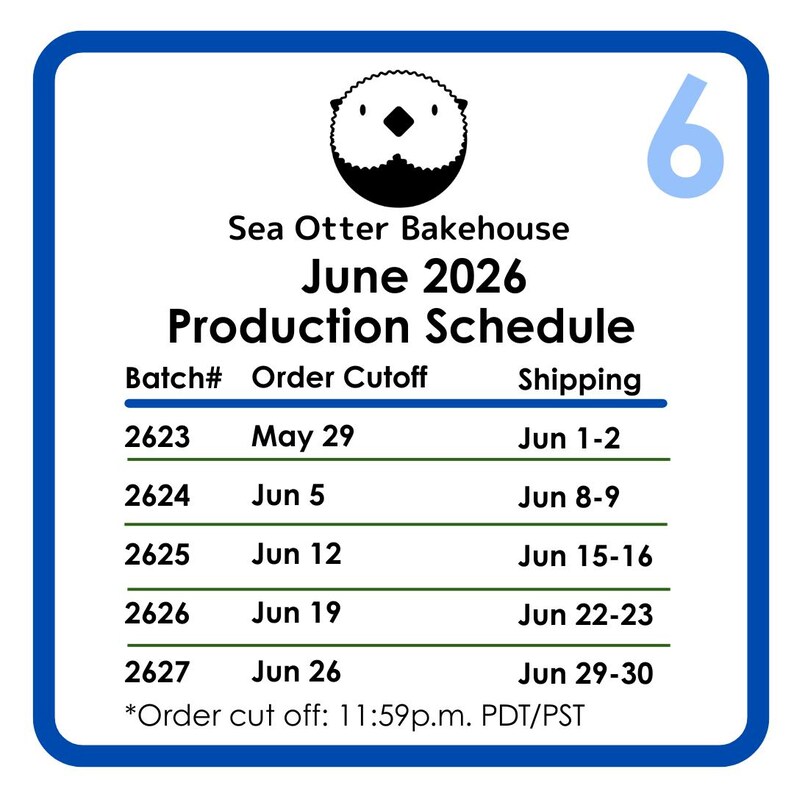 May include: A square white sign with a blue border featuring a black sea otter icon and the number 6 in the top right corner. The text reads Sea Otter Bakehouse June 2026 Production Schedule with a table listing batch numbers, order cutoffs, and shipping dates.