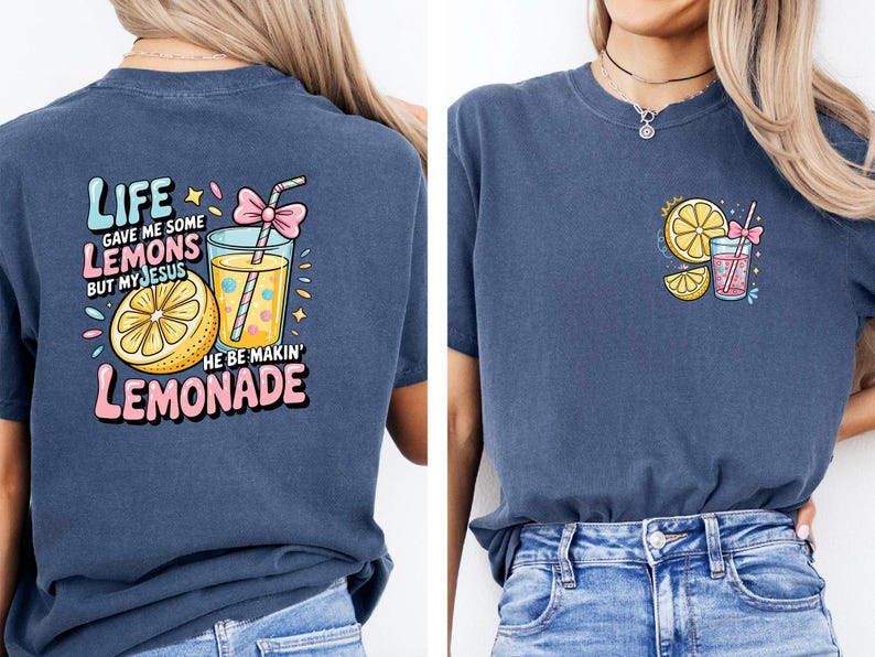May include: Navy blue t-shirt with a colorful graphic of a lemon, lemonade, and text that reads "Life gave me some lemons but my Jesus he be makin' lemonade." A smaller version of the graphic is on the front.