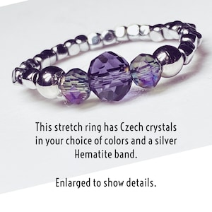 May include: A stretch ring with a silver Hematite band and three purple Czech crystals. This ring is designed to fit most sizes.