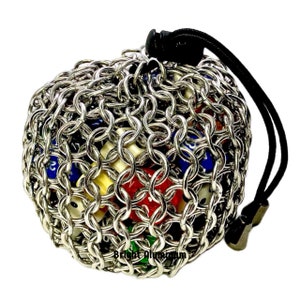 Chainmail bag, pouch is closed by paracord with cone end caps, secured with a spring lock.  Size medium, expands to 4”x5”. Colors