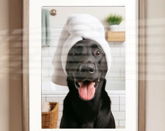 May include: A black dog wearing a white towel on its head, looking directly at the camera with its tongue sticking out. The dog is in a bathroom setting with white tiled walls and a white bathtub.