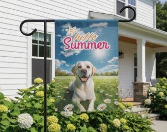 May include: A garden flag featuring a yellow Labrador Retriever lying in a field of daisies under a sunny sky. The flag reads "hello Summer" in pink script with a sun graphic.