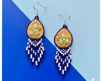 Blue beaded floral dangle earring with suede accent (native motif)