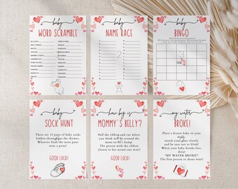May include: A set of six printable baby shower game cards with pink and red hearts. The games include: Word Scramble, Name Race, Bingo, Sock Hunt, How Big is Mommy's Belly?, and My Water Broke.
