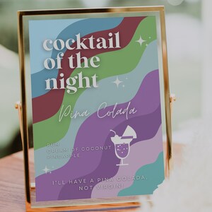May include: A sign with a colorful abstract background and the text "cocktail of the night Pina Colada" with a list of ingredients: rum, cream of coconut, pineapple. The sign also includes the text "I'll have a Pina Colada, not virgin!"