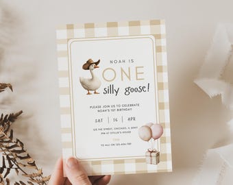 May include: A light brown and white gingham patterned invitation with a cartoon goose wearing a cowboy hat. The text reads "Noah is One silly goose!" and includes details for a birthday party.