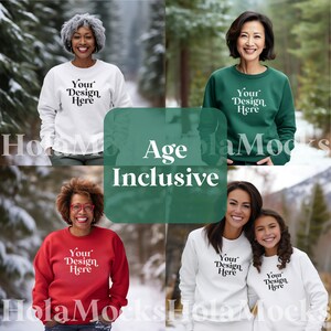 May include: Four people wearing sweatshirts in white, red, and green. Each sweatshirt has the text "Your Design Here". The image is set against a snowy, outdoor background. The words "Age Inclusive" are also displayed.
