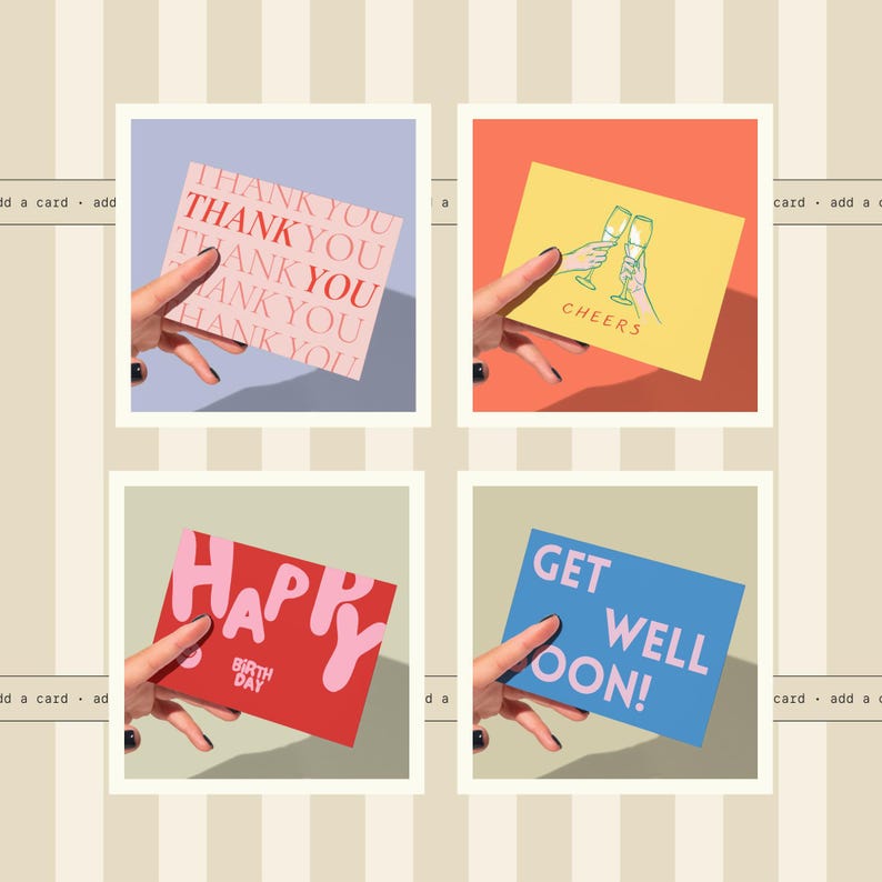 four different greeting cards being held by a hand, each with a unique design and message.