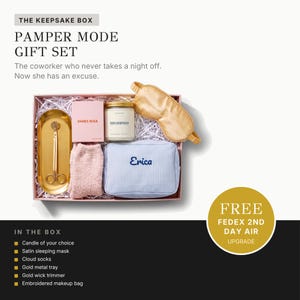 The image is an advertisement for a gift set called "The Keepsake Box" that includes a pamper mode gift set for a coworker who never takes a night off. The gift set includes a sleeping mask, cotton socks, a gold metal tray, and an embroidered makeup bag.