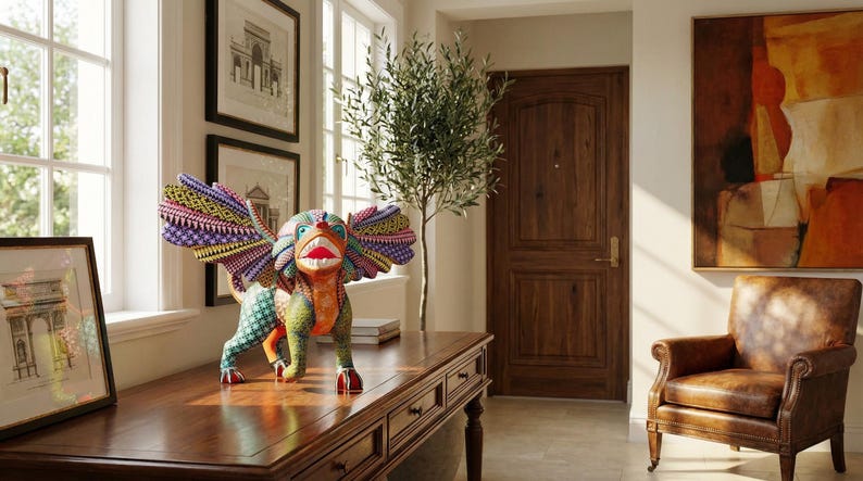 May include: A hand-painted wooden alebrije sculpture featuring a mythical creature with large, spread wings. The figure is decorated with intricate, colourful geometric patterns in shades of green, orange, purple, and yellow, with a wide, open mouth.