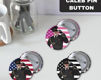 May include: Four pin-back buttons featuring a cartoon character wearing a military uniform and sunglasses. The character is standing in front of an American flag. The buttons are on a white surface.  "Caleb Pin Button" is written in black text on a white rectangle.