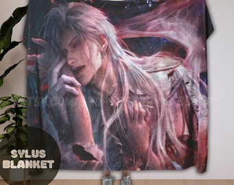 May include: A large, rectangular blanket featuring a detailed illustration of a person with long, white hair and a wing-like design. The artwork is predominantly in shades of purple, pink, and blue. The blanket has the text "SYLUS BLANKET" in a circular logo.